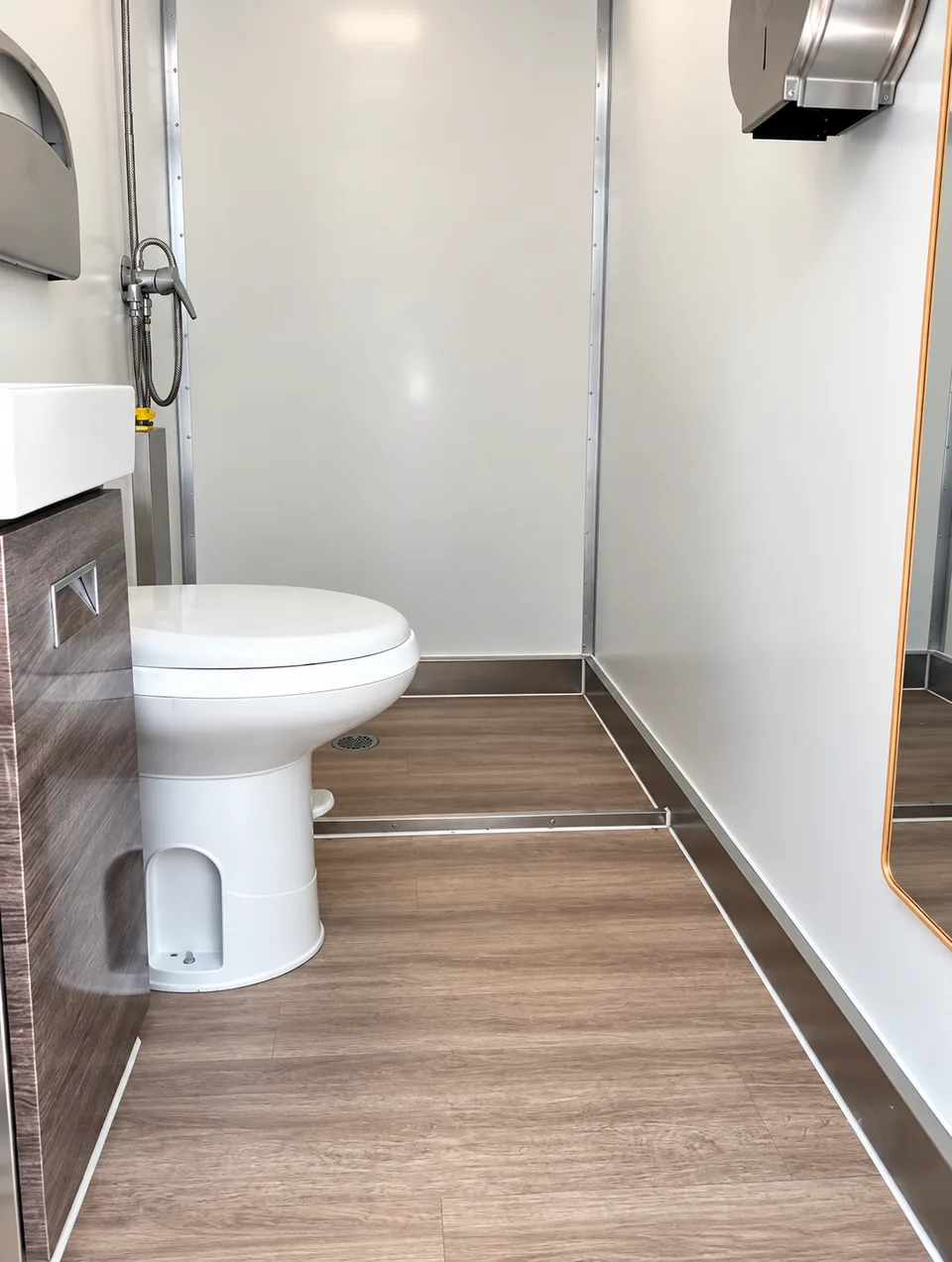 Luxury shower restroom trailer interior in the 13 ft three-stall shower and restroom combination trailer